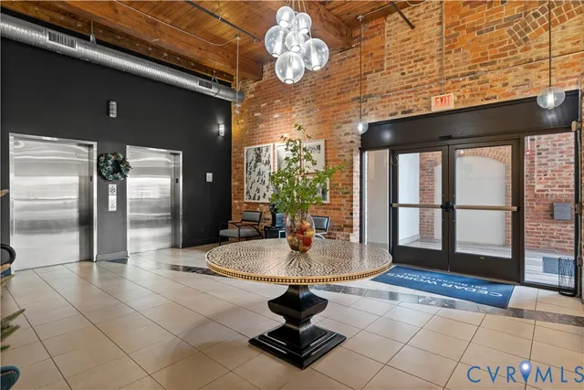 a front view of a building with a garden