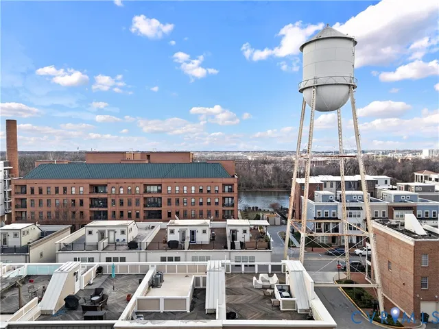 an aerial view of a city with lake view