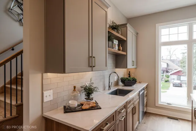 a kitchen with cabinets and window