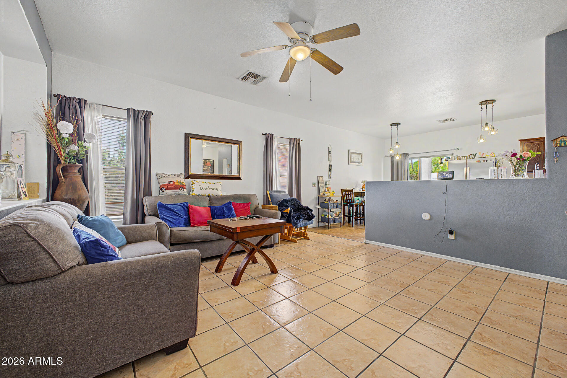 9730 West Payson Road Tolleson, AZ 85353 - Photo 10 of 57 a living room with furniture and a couch