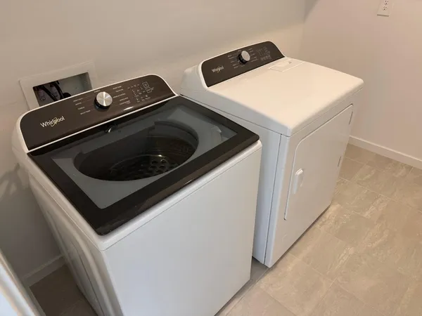 a utility room with dryer and washer