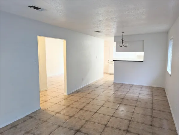 a view of a kitchen with a sink and a window
