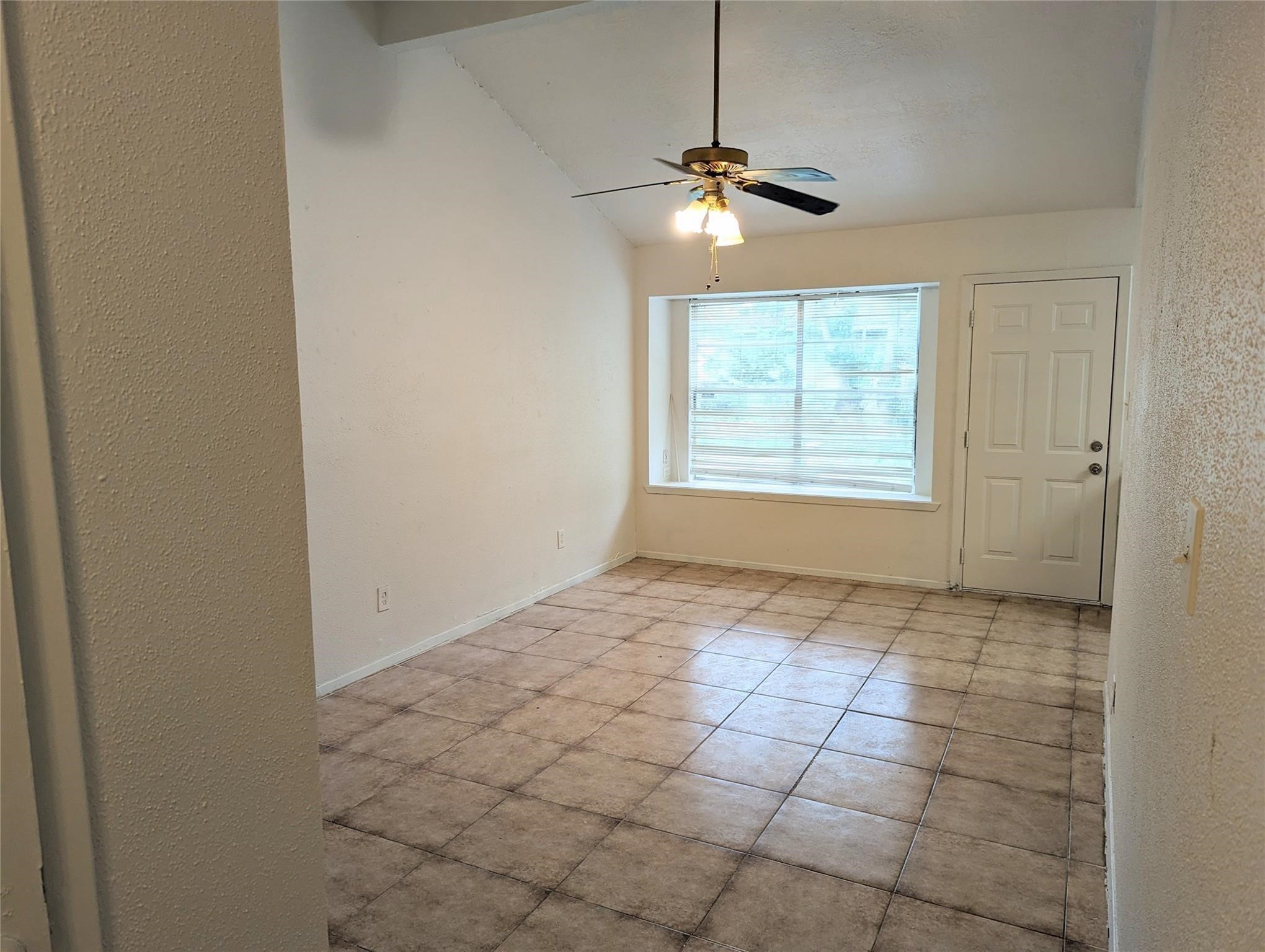 5150 Prairie Ridge Road Houston, TX 77053 - Photo 4 of 14 a view of an empty room and chandelier fan