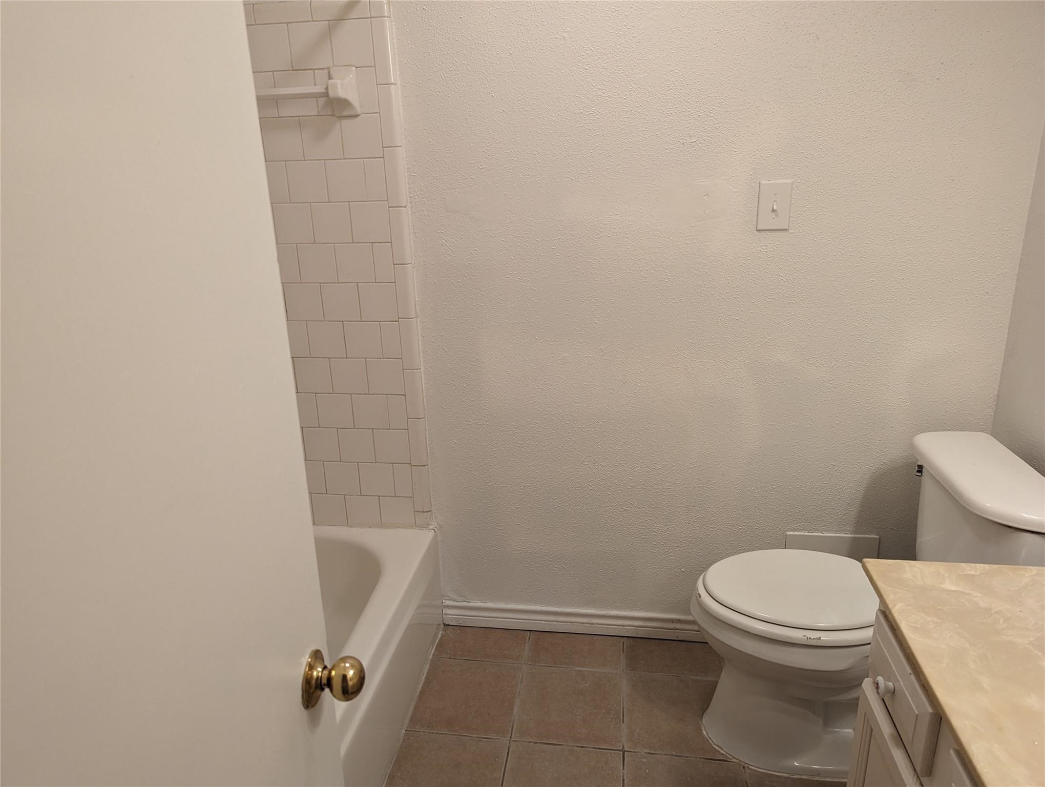 5150 Prairie Ridge Road Houston, TX 77053 - Photo 10 of 14 a bathroom with a toilet and a shower