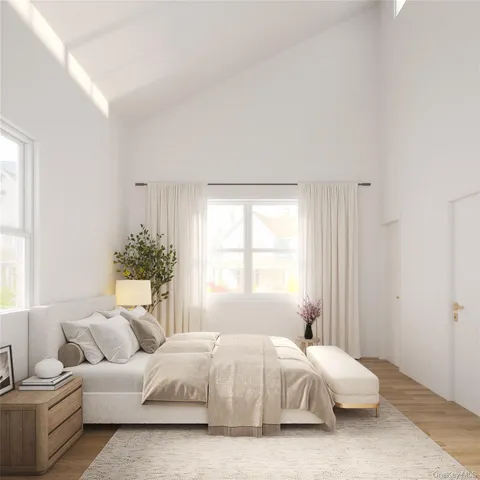 a spacious bedroom with a bed and a couch