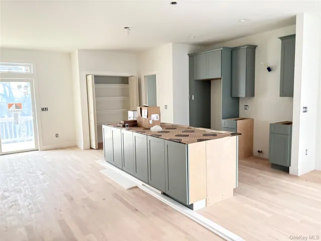 a kitchen with stainless steel appliances granite countertop a sink and a refrigerator