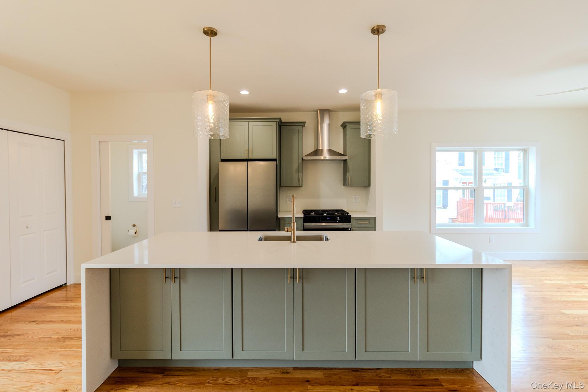 1 Ridge Avenue Port Jervis, NY 12771 - Photo 4 of 31 a kitchen with kitchen island a counter top space a sink stainless steel appliances and cabinets
