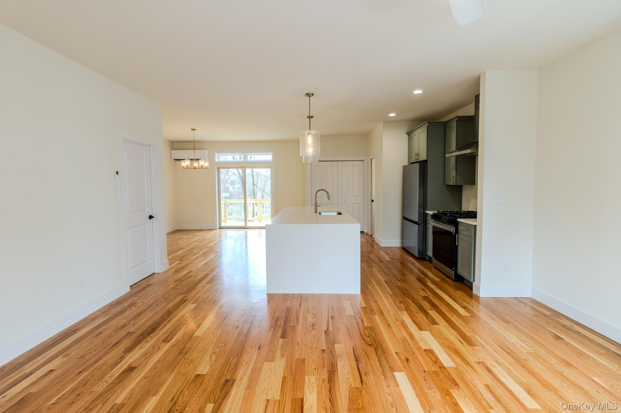 1 Ridge Avenue Port Jervis, NY 12771 - Photo 8 of 31 a view of a kitchen with wooden floor and stainless steel appliances