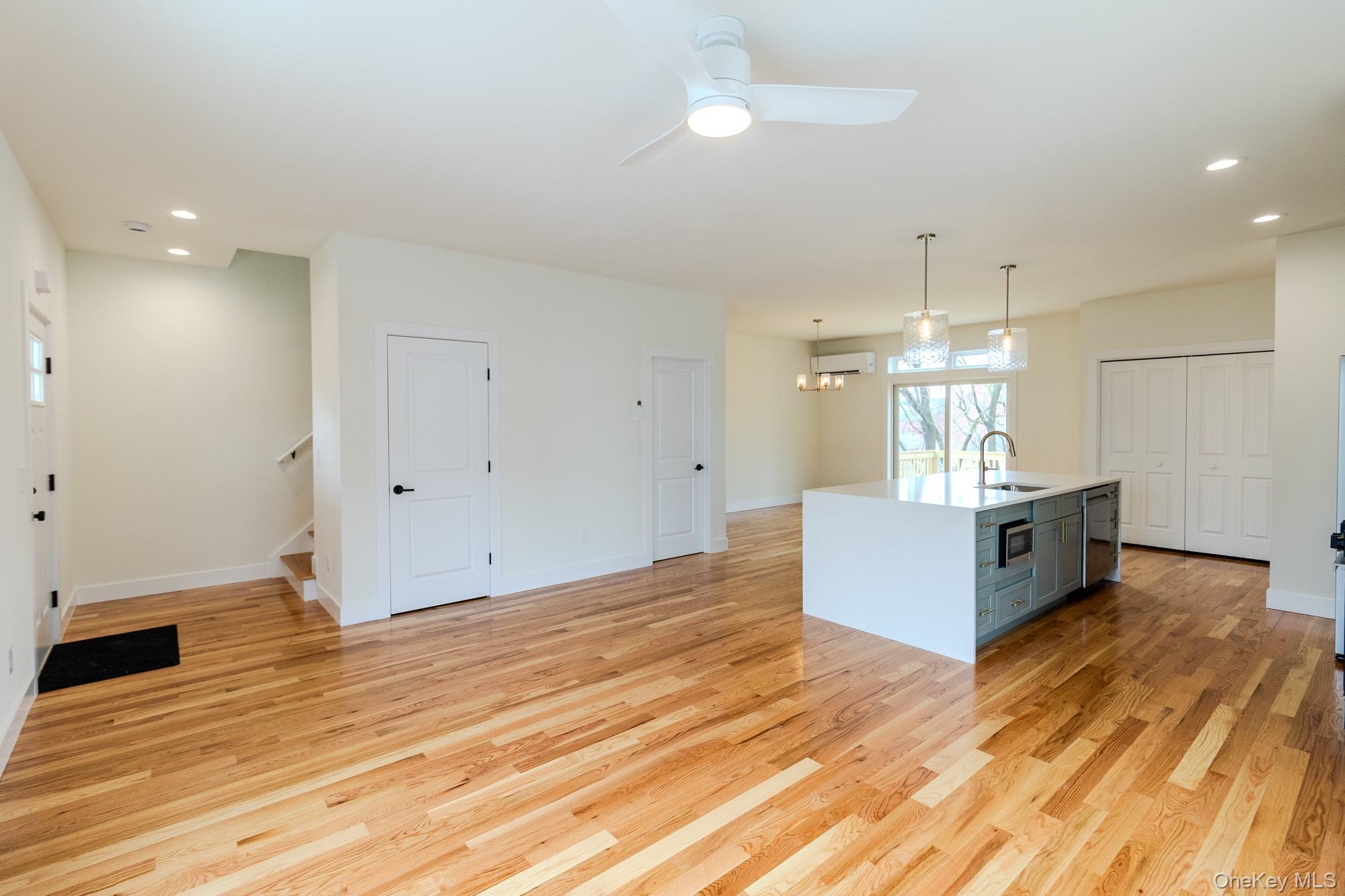 1 Ridge Avenue Port Jervis, NY 12771 - Photo 9 of 31 a large white kitchen with kitchen island a sink stainless steel appliances and cabinets