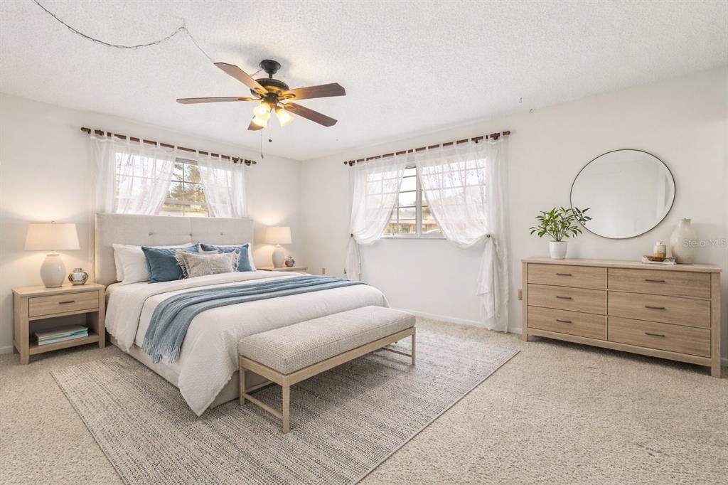 15218 Southwest 43rd Terrace Road Ocala, FL 34473 - Photo 17 of 30 a bedroom with a bed and a dresser