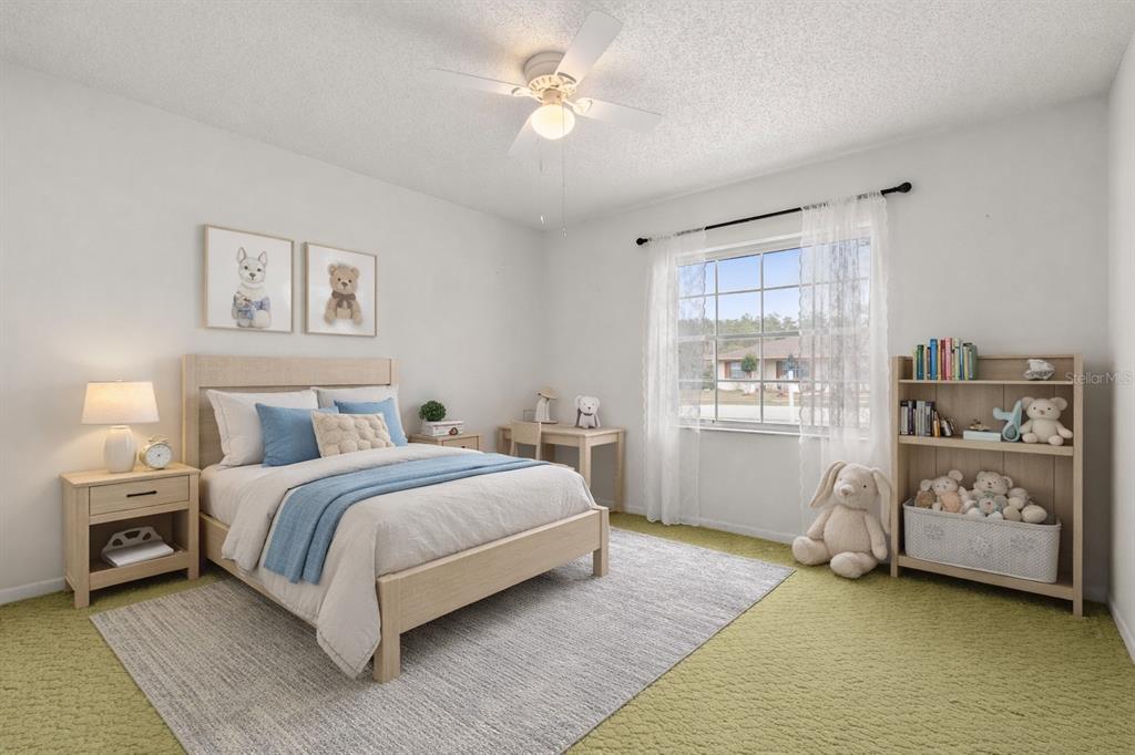 15218 Southwest 43rd Terrace Road Ocala, FL 34473 - Photo 23 of 30 a spacious bedroom with a bed and a window