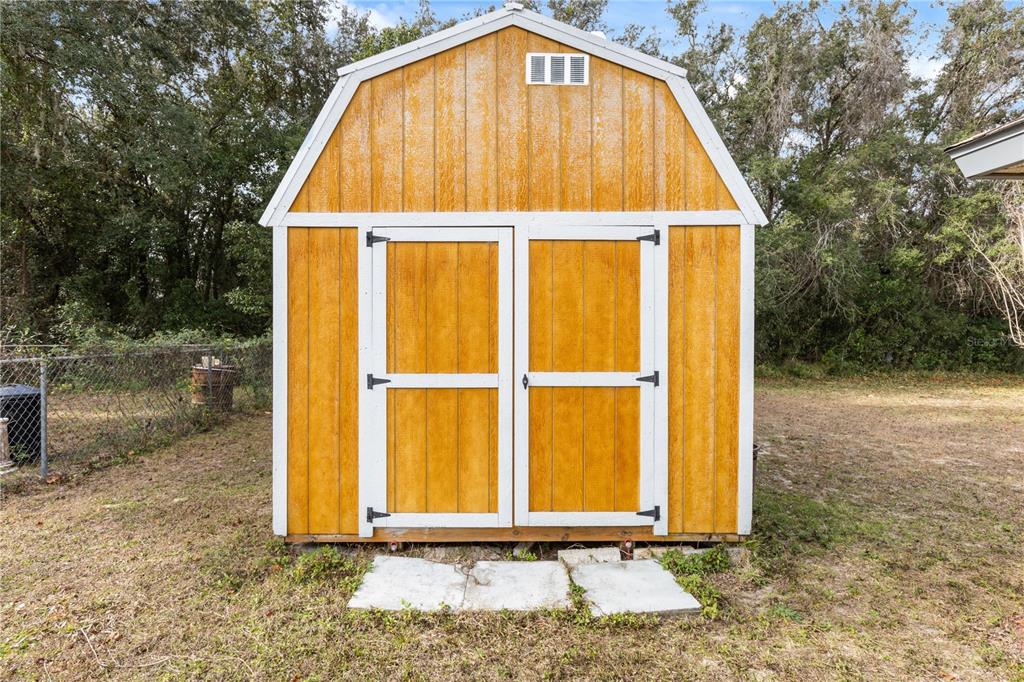 15218 Southwest 43rd Terrace Road Ocala, FL 34473 - Photo 25 of 30 a view of backyard with small cabin