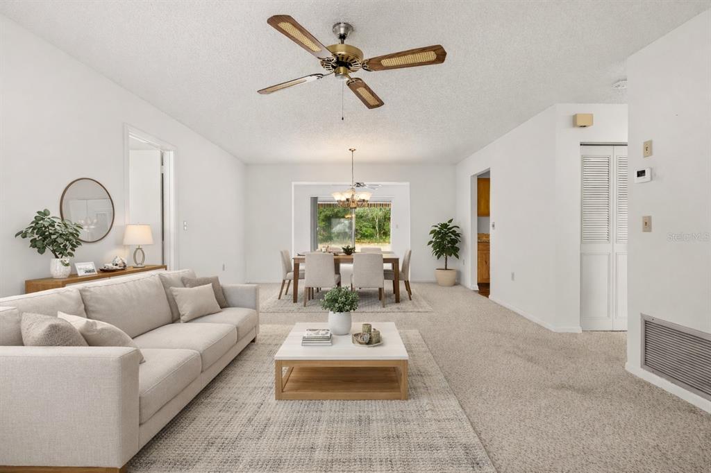 15218 Southwest 43rd Terrace Road Ocala, FL 34473 - Photo 7 of 30 a living room with furniture chandelier and a chandelier