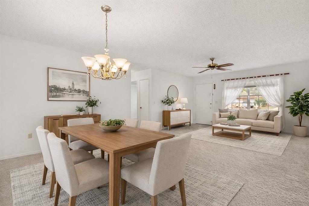 15218 Southwest 43rd Terrace Road Ocala, FL 34473 - Photo 9 of 30 a view of a dining room with furniture and a chandelier