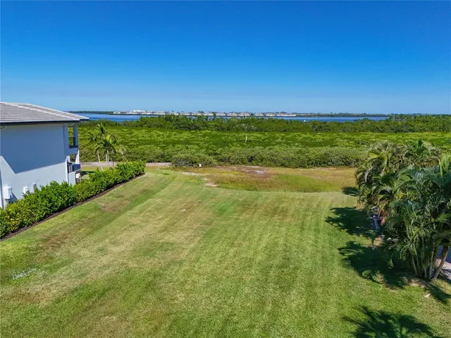 a view of an ocean and a yard