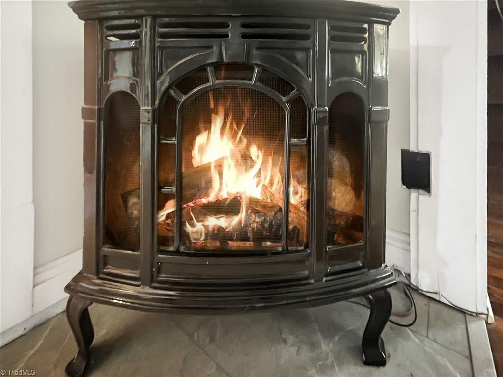 286 Pike Road Moravian Falls, NC 28654 - Photo 15 of 38 Gas log stove at entrance to Den/Dining Area