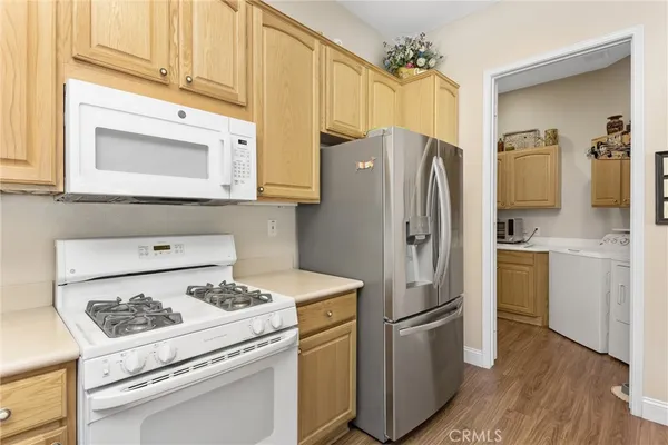 a kitchen with stainless steel appliances a refrigerator stove and sink
