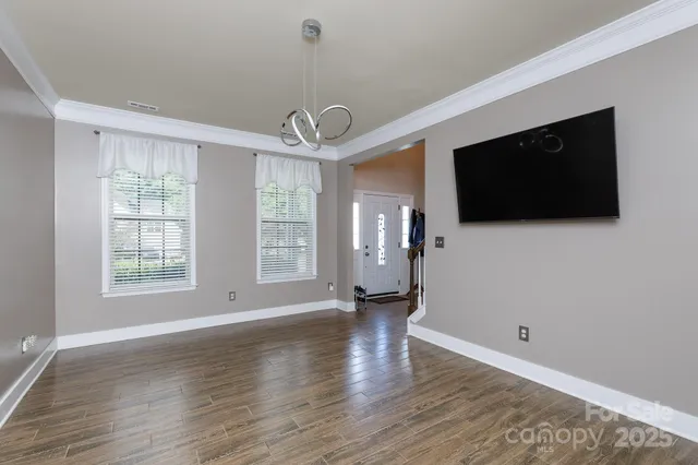 a view of a livingroom with wooden floor