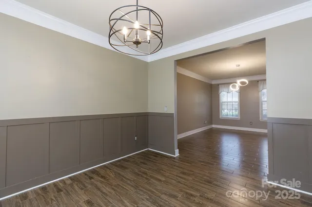a bathroom with a sink vanity mirror and toilet