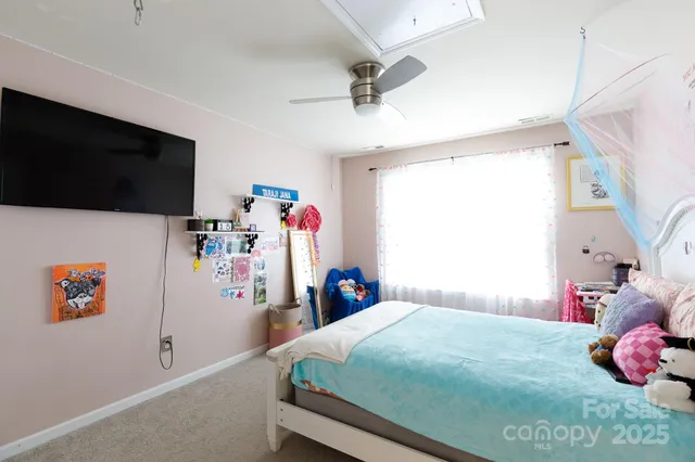 a view of a livingroom with furniture and a window