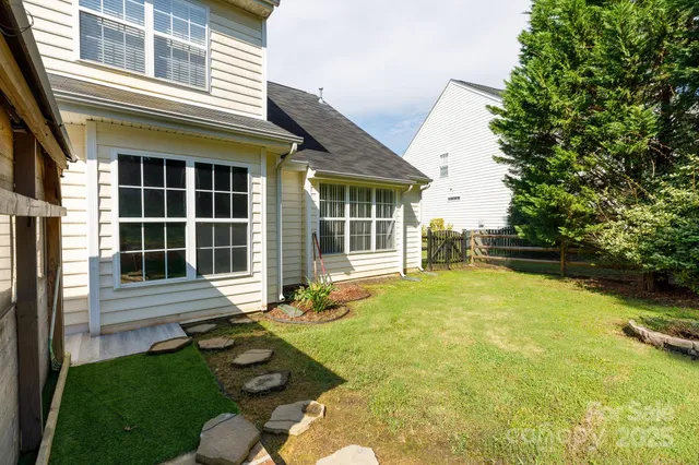 a view of a yard with a tree