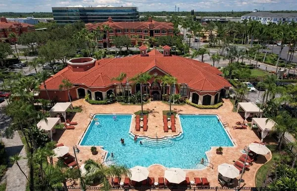 an aerial view of residential houses and outdoor space