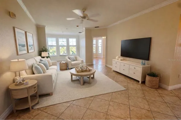 a living room with furniture and a flat screen tv