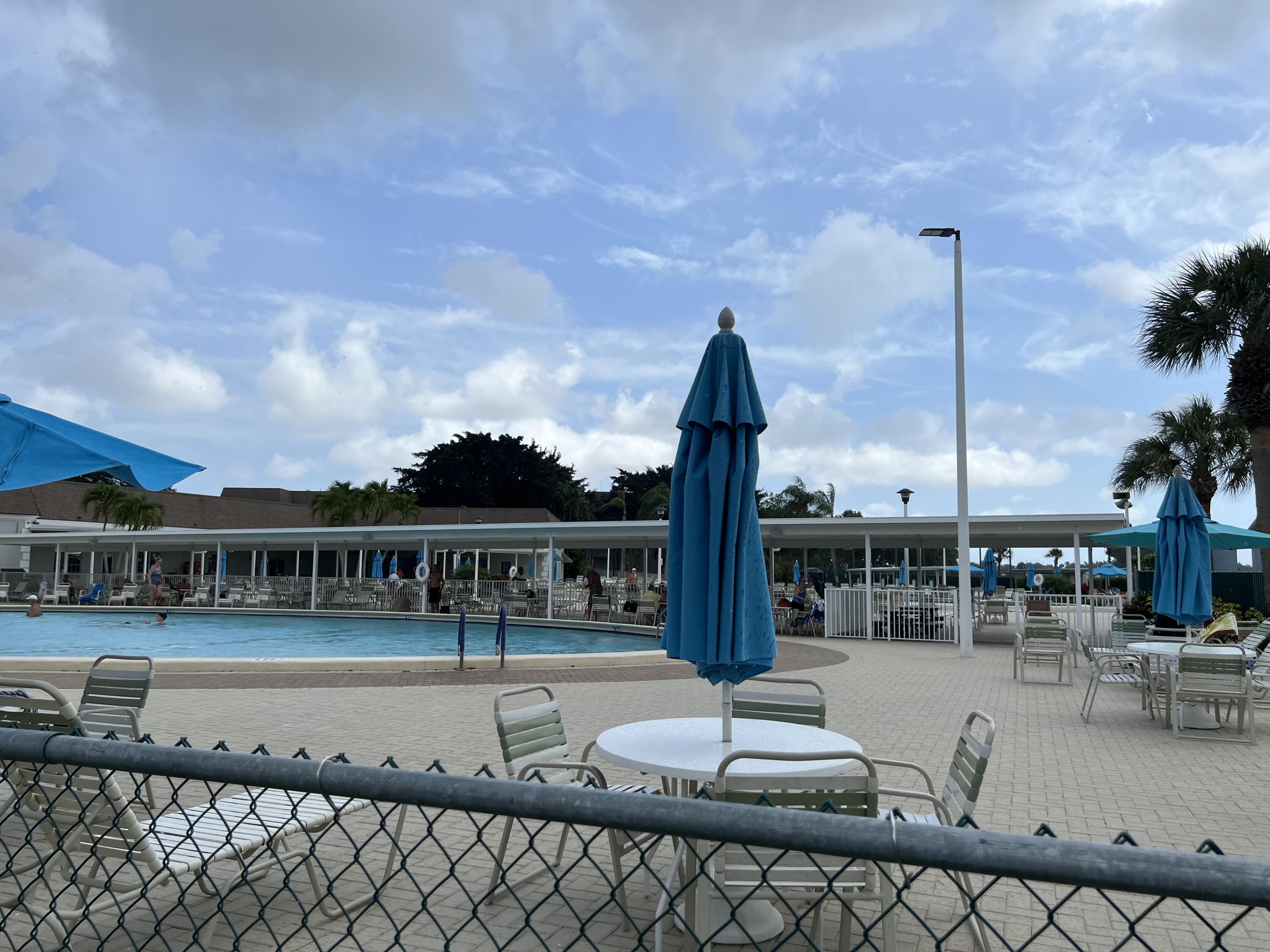886 Flanders South Delray Beach, FL 33484 - Photo 1 of 41 a view of a patio with swimming pool