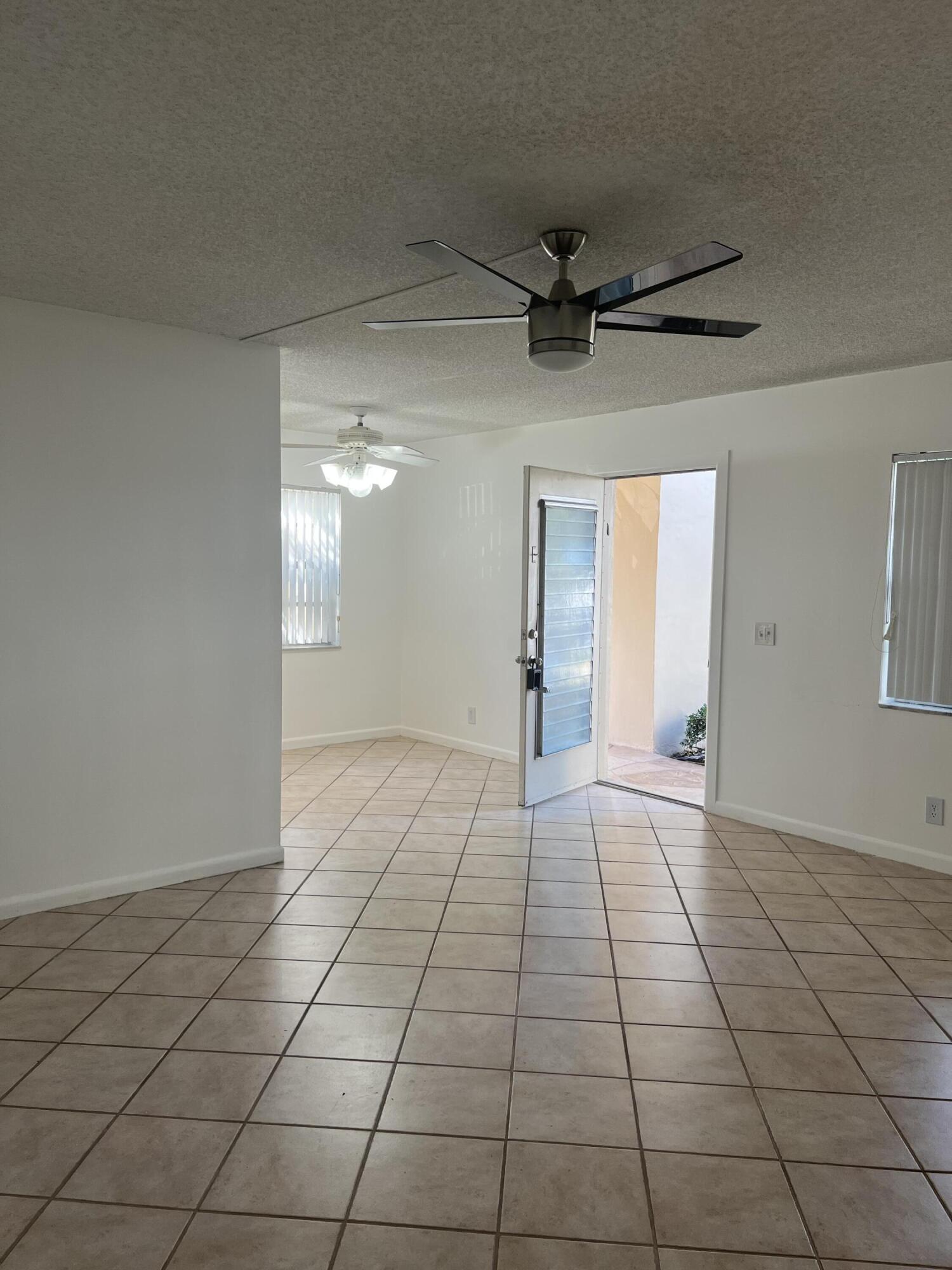886 Flanders South Delray Beach, FL 33484 - Photo 14 of 41 a view of an empty room and a window
