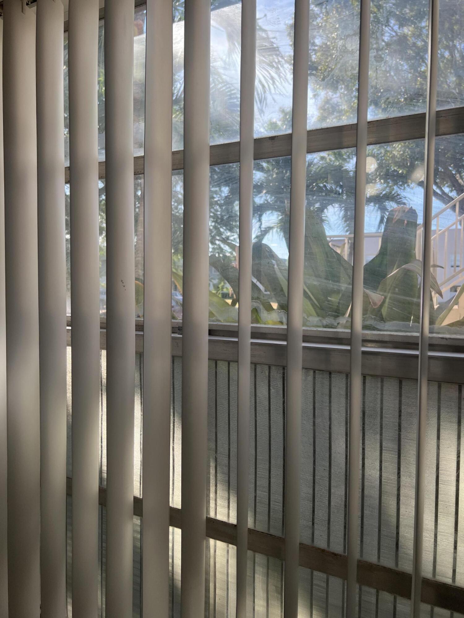 886 Flanders South Delray Beach, FL 33484 - Photo 20 of 41 a view of a glass door with a glass door