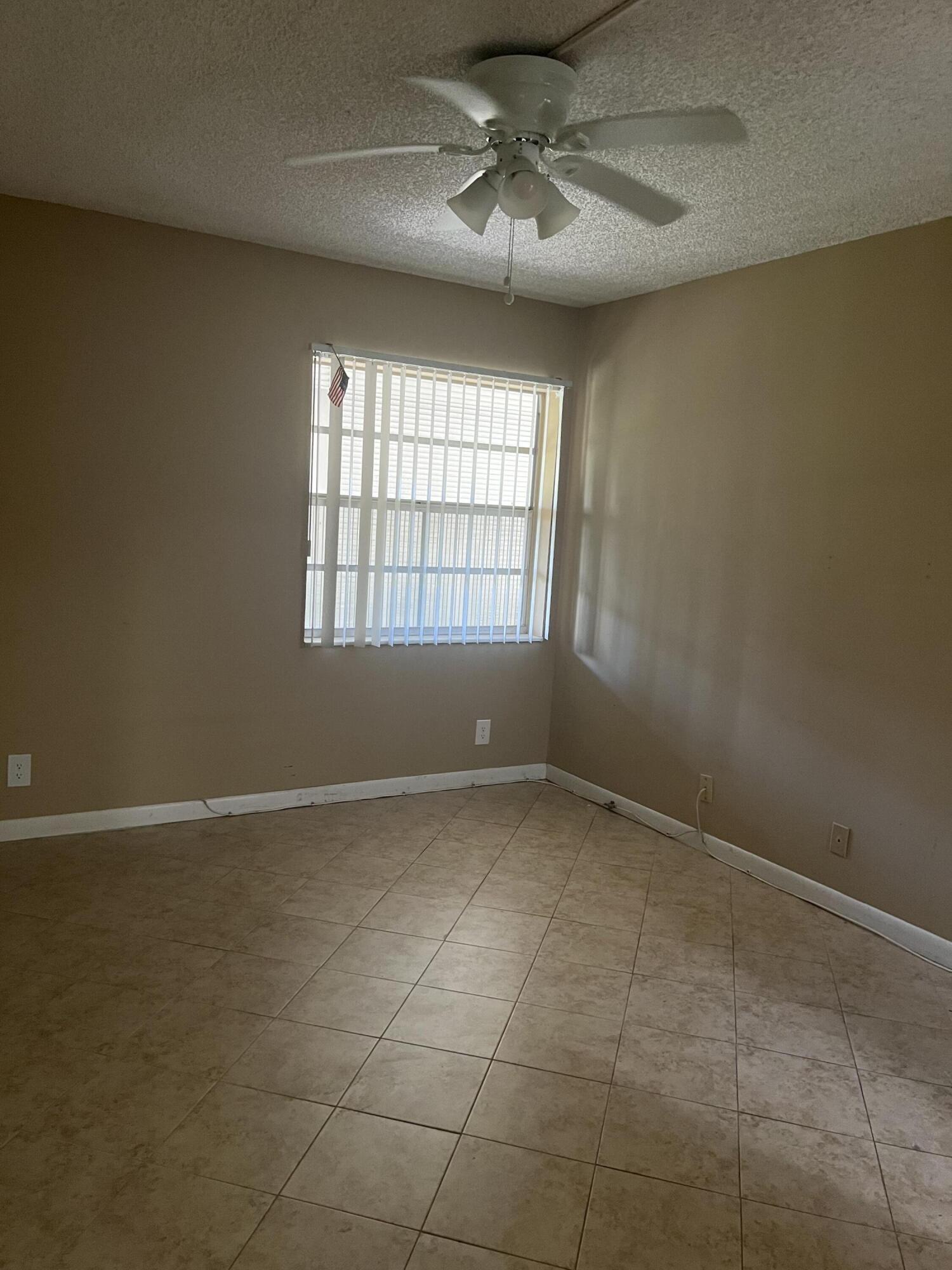 886 Flanders South Delray Beach, FL 33484 - Photo 22 of 41 a view of an empty room with a window