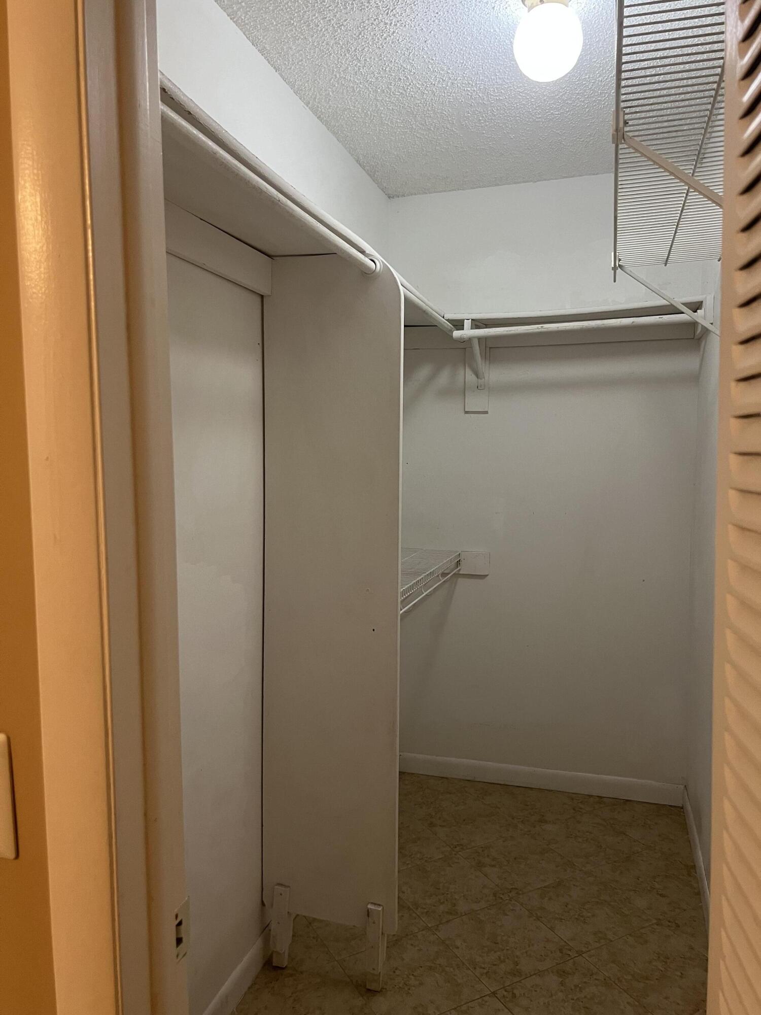 886 Flanders South Delray Beach, FL 33484 - Photo 23 of 41 a view of an empty walk in closet