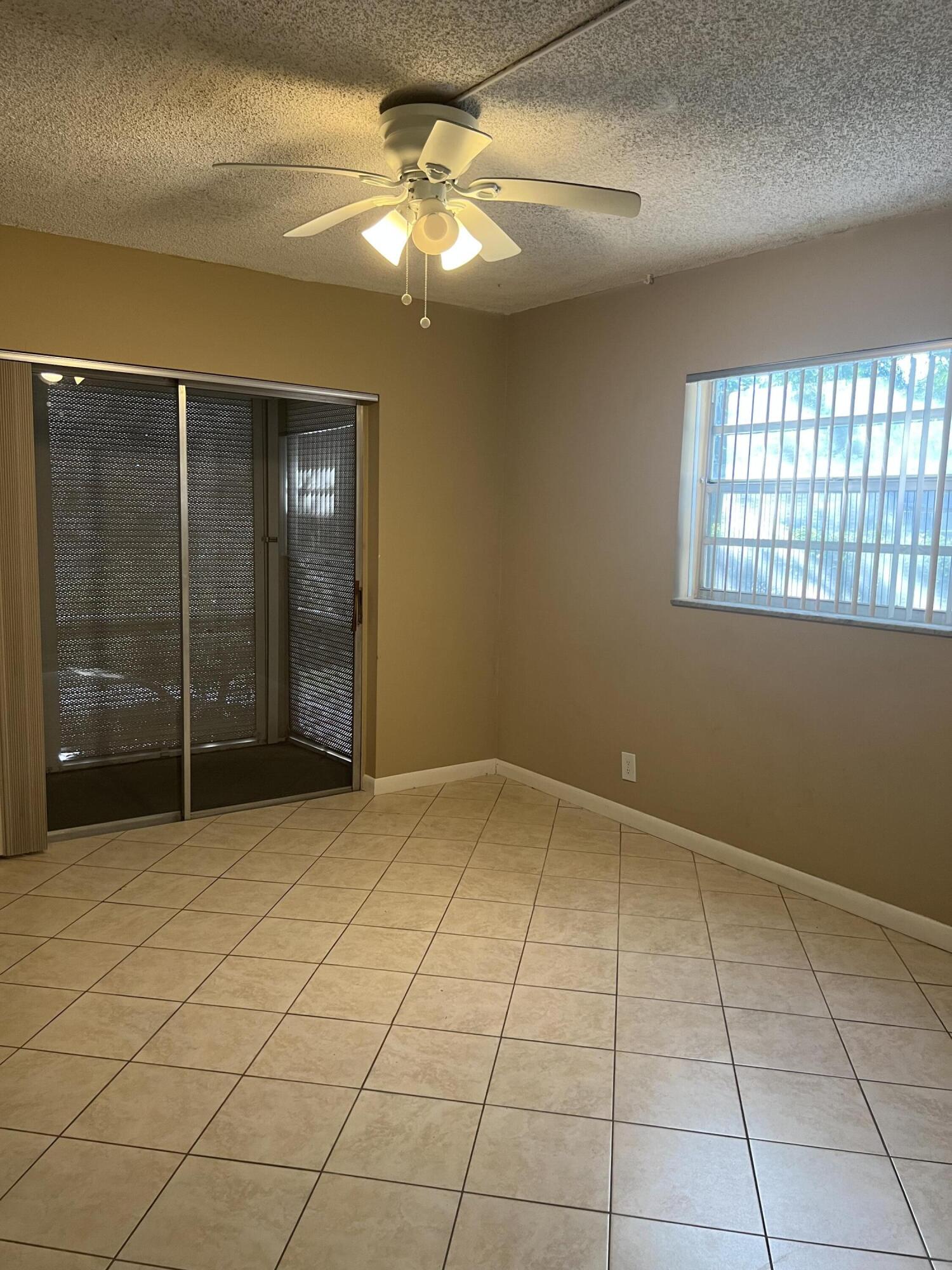 886 Flanders South Delray Beach, FL 33484 - Photo 3 of 41 a view of an empty room with a window