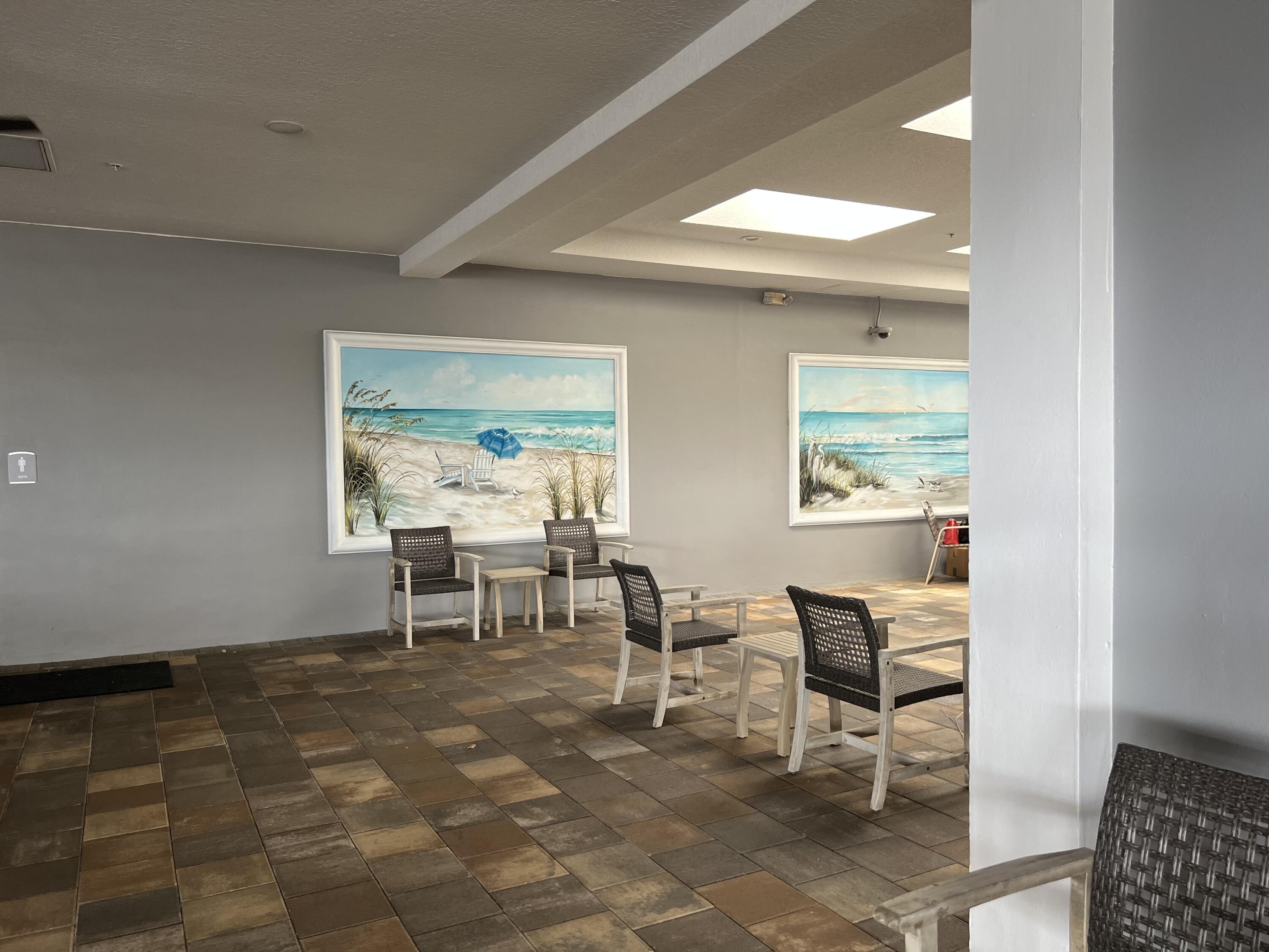 886 Flanders South Delray Beach, FL 33484 - Photo 36 of 41 a dining room with wooden floor and a window