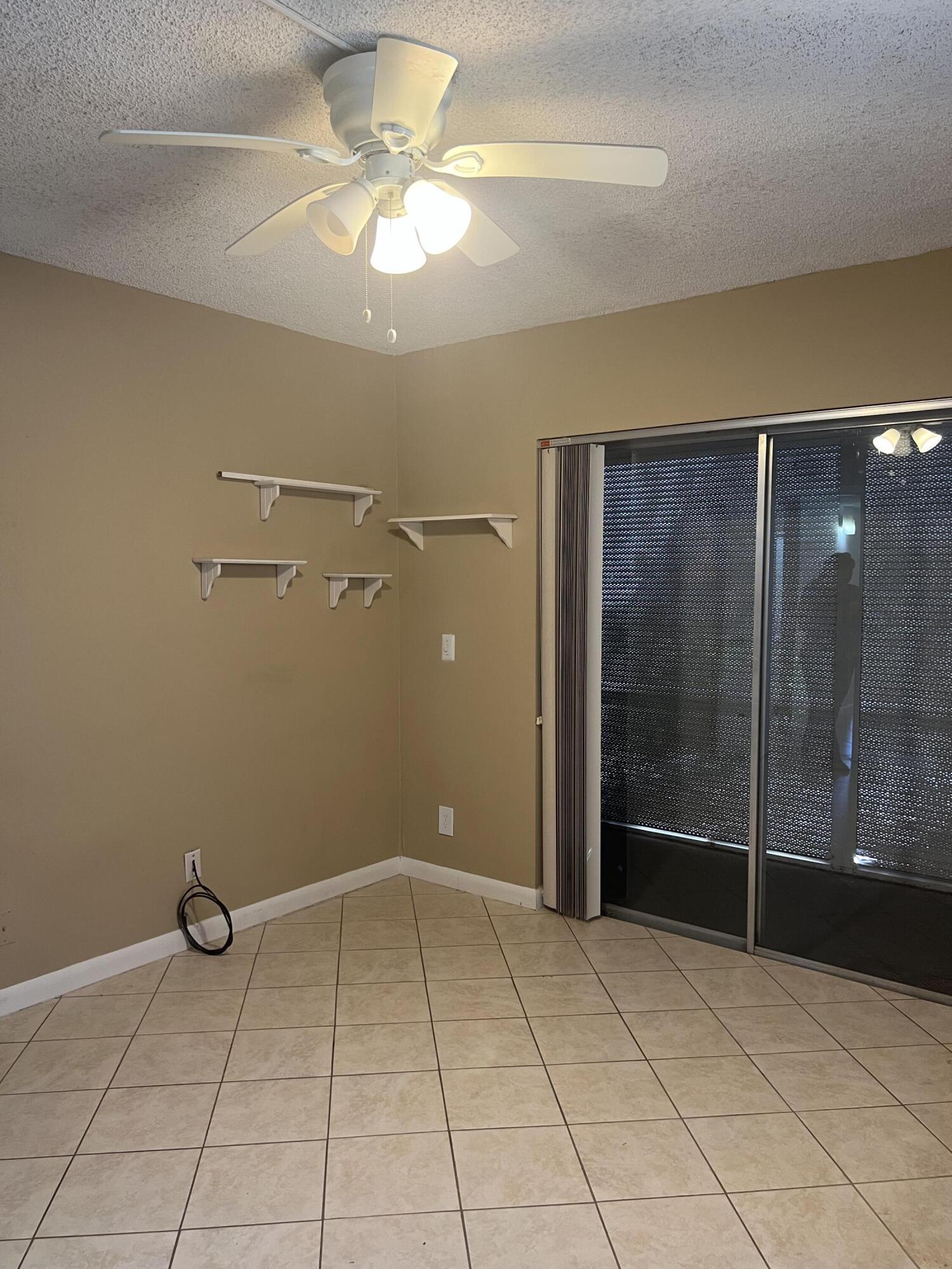 886 Flanders South Delray Beach, FL 33484 - Photo 8 of 41 a view of an empty room with a bathroom