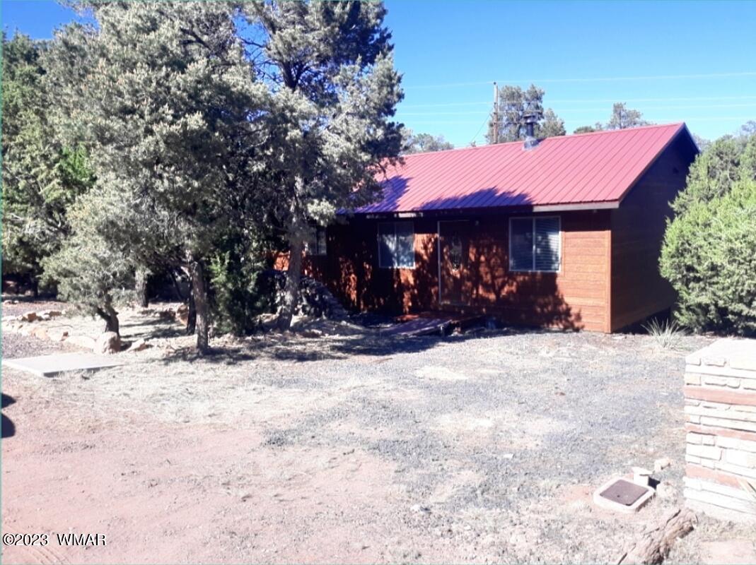 3521 Deer Track Trail Overgaard, AZ 85933 - Photo 1 of 7 a view of a house with a yard