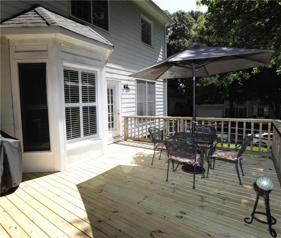 12522 Hawks Ridge Road Huntersville, NC 28078 - Photo 5 of 30 a patio with wooden floors and outdoor seating