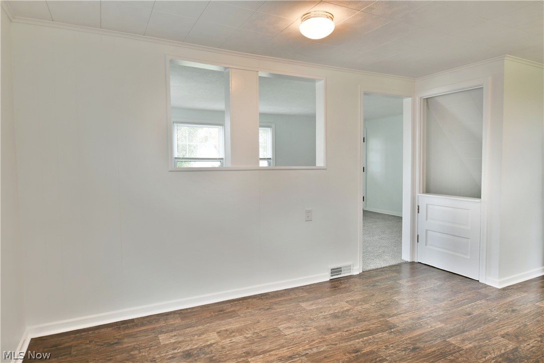 130 State Road Northwest Warren, OH 44483 - Photo 10 of 35 Empty room with hardwood / wood-style floors