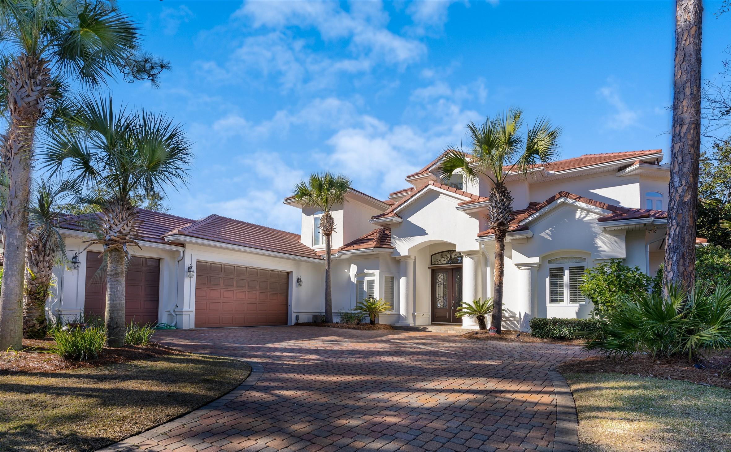 2949 Pine Valley Road Miramar Beach, FL 32550 - Photo 1 of 29 a front view of a house with a yard and garage