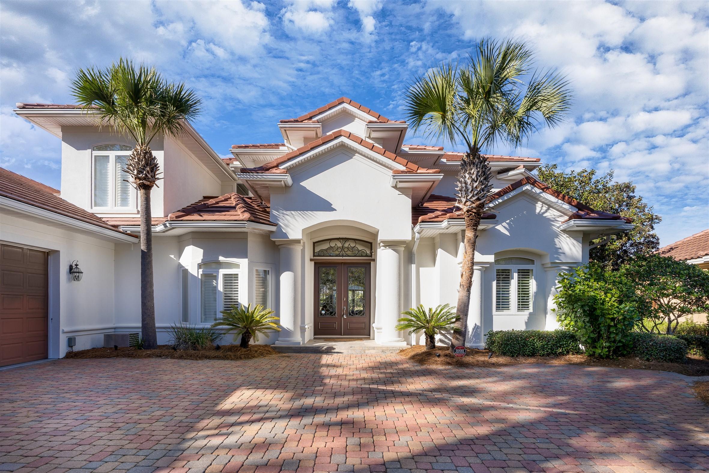 2949 Pine Valley Road Miramar Beach, FL 32550 - Photo 2 of 29 a front view of a house with a garden