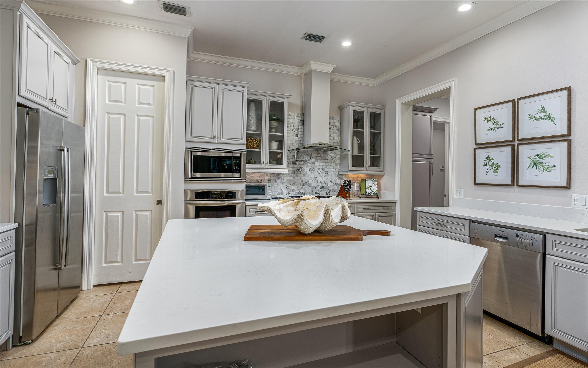 2949 Pine Valley Road Miramar Beach, FL 32550 - Photo 11 of 29 a kitchen with a sink a stove and chairs