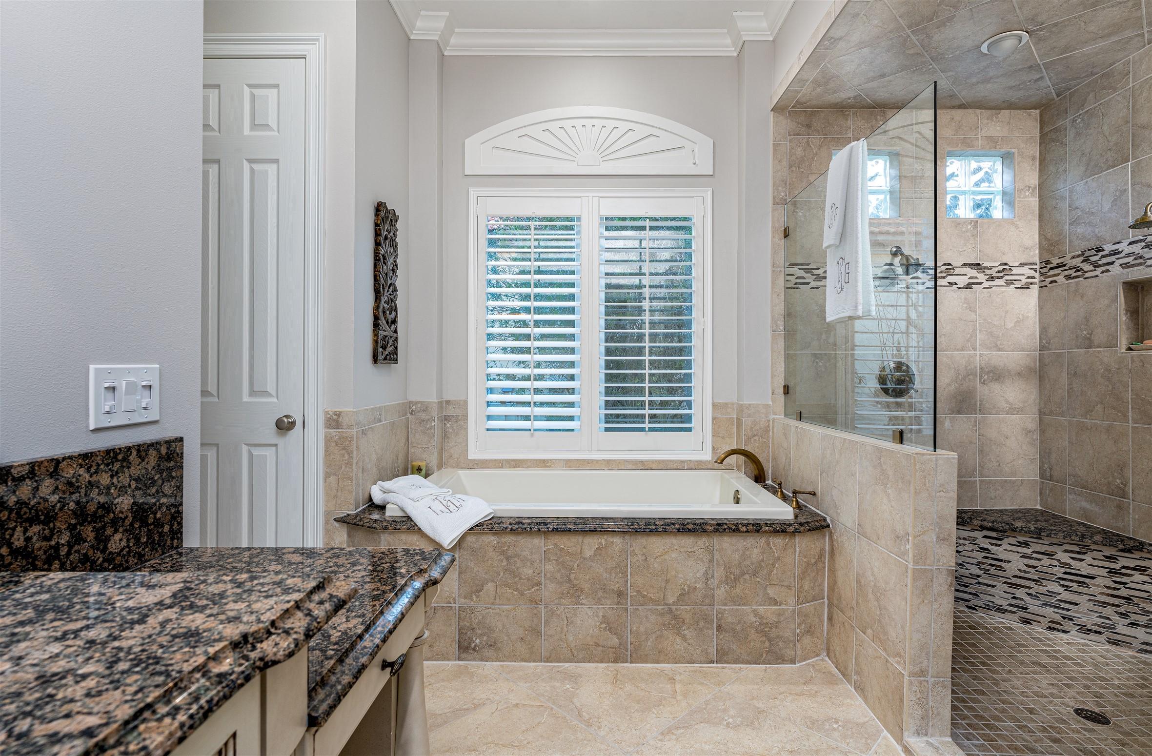 2949 Pine Valley Road Miramar Beach, FL 32550 - Photo 15 of 29 a spacious bathroom with a granite countertop tub shower and sink