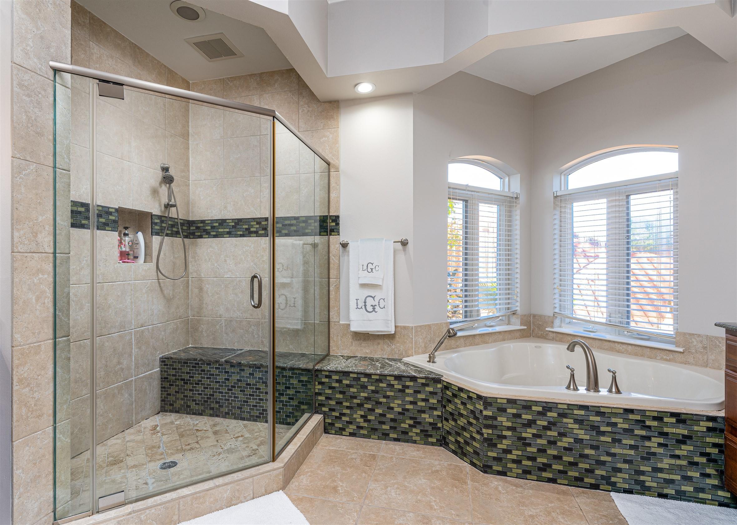 2949 Pine Valley Road Miramar Beach, FL 32550 - Photo 9 of 29 a bathroom with a bathtub a shower a sink and mirror