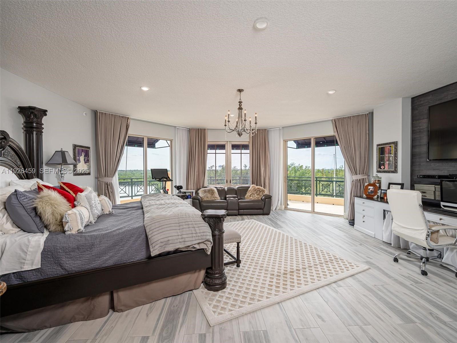 3415 North Ocean Drive, Unit 605 Hollywood, FL 33019 - Photo 15 of 31 a living room with furniture and a flat screen tv