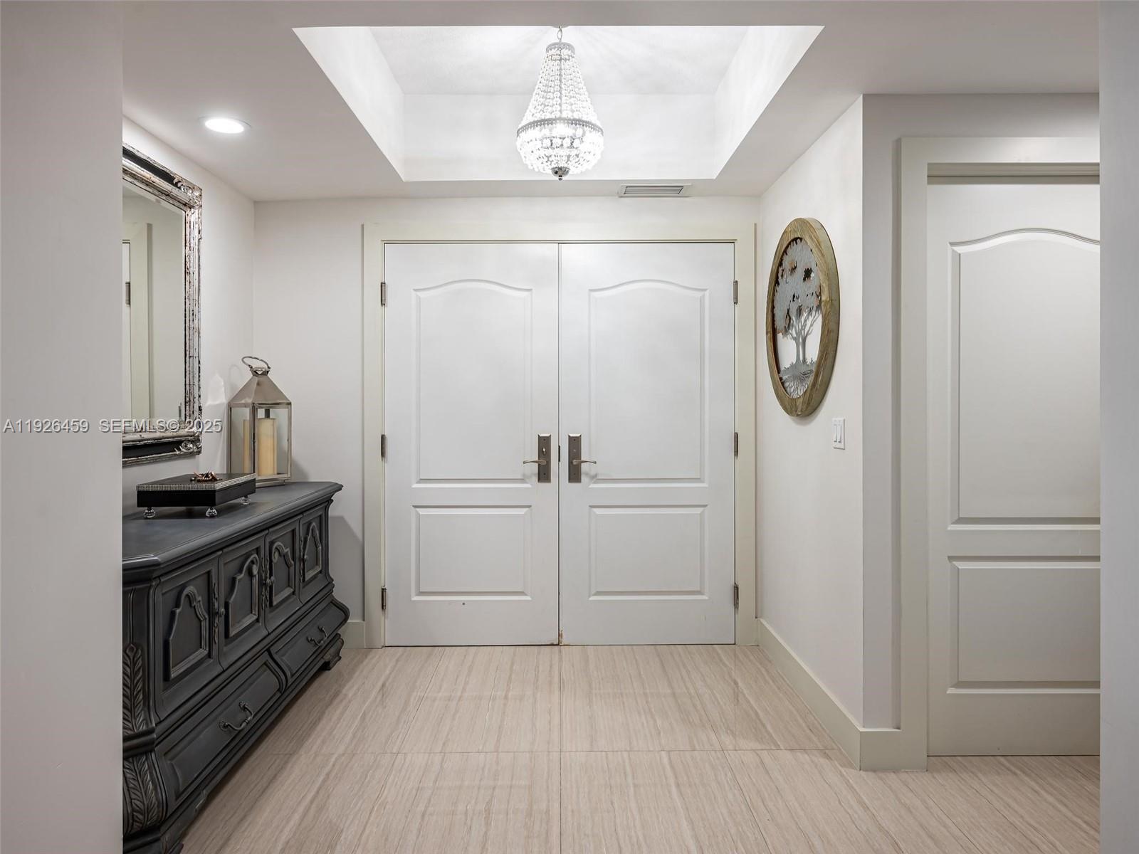 3415 North Ocean Drive, Unit 605 Hollywood, FL 33019 - Photo 2 of 31 a view of a hallway with washer and dryer