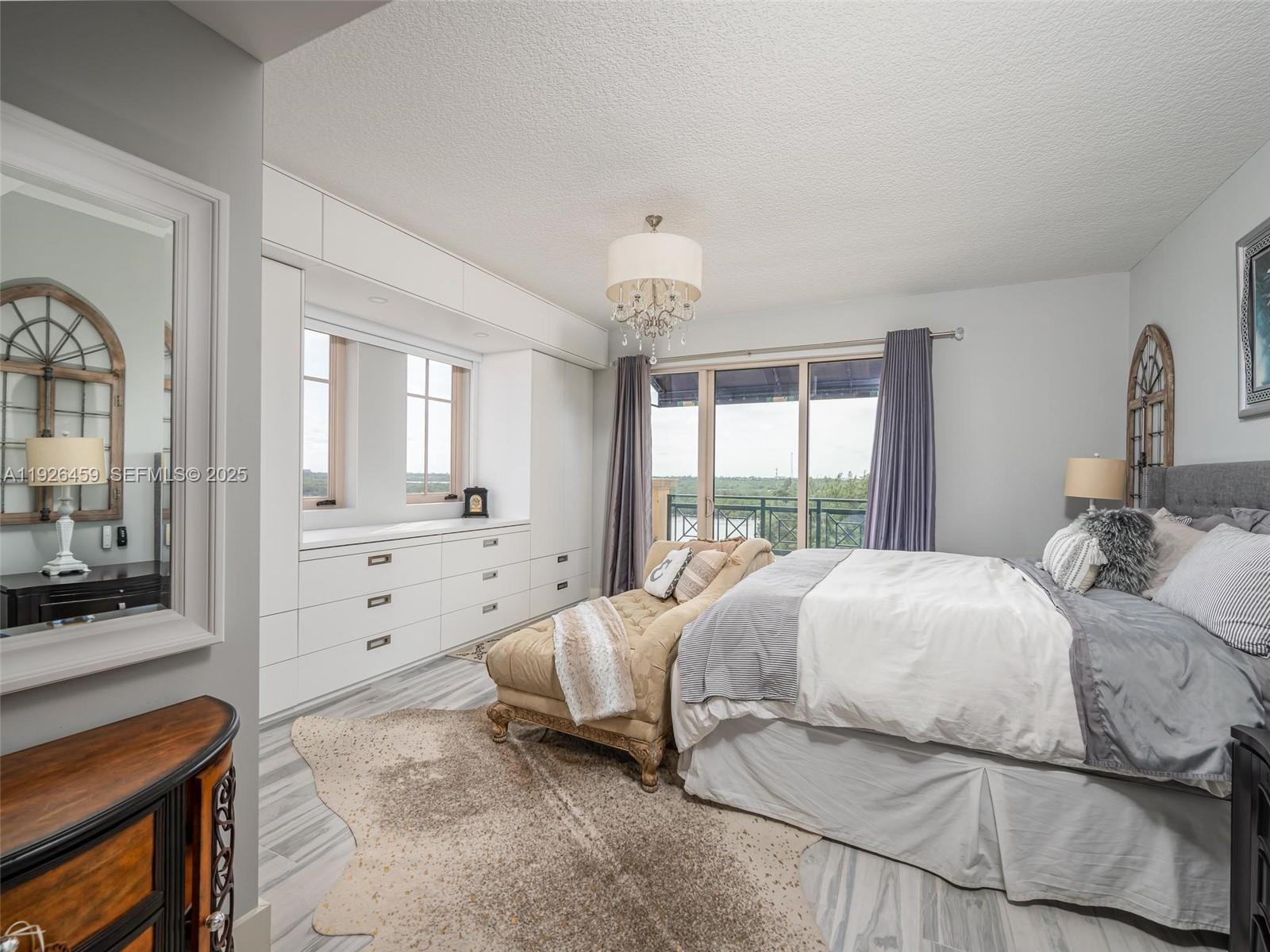 3415 North Ocean Drive, Unit 605 Hollywood, FL 33019 - Photo 23 of 31 a bedroom with a bed and a dresser