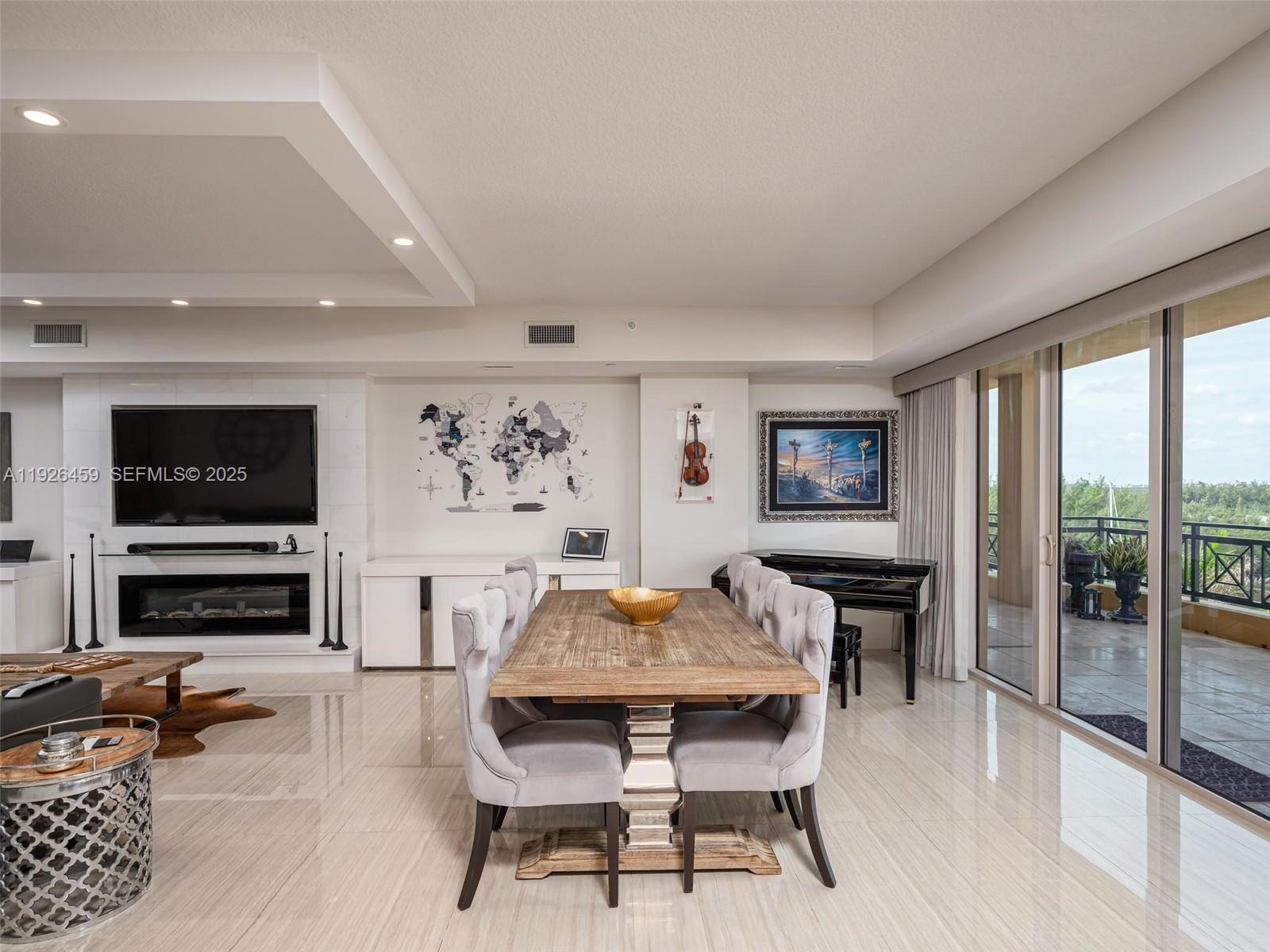 3415 North Ocean Drive, Unit 605 Hollywood, FL 33019 - Photo 5 of 31 a dining room with furniture and window