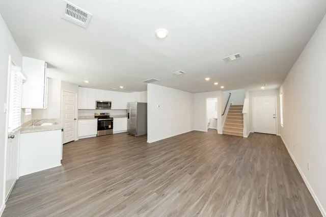 a view of kitchen with wooden floor