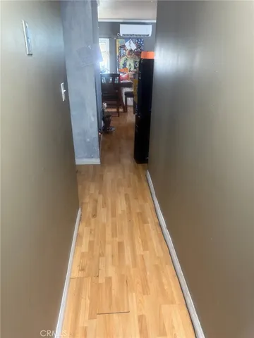 a view of a hallway with living room