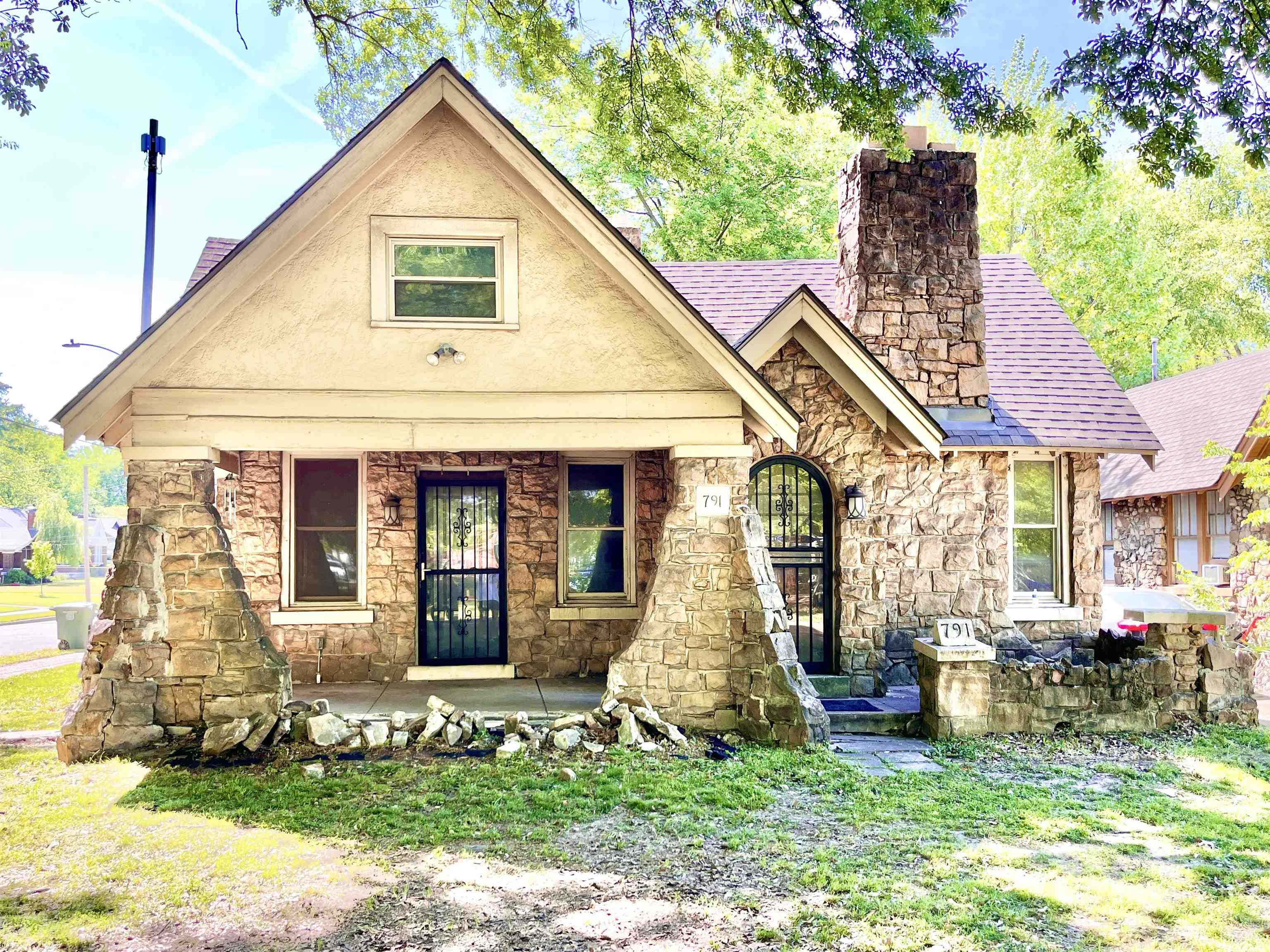 a front view of a house with garden